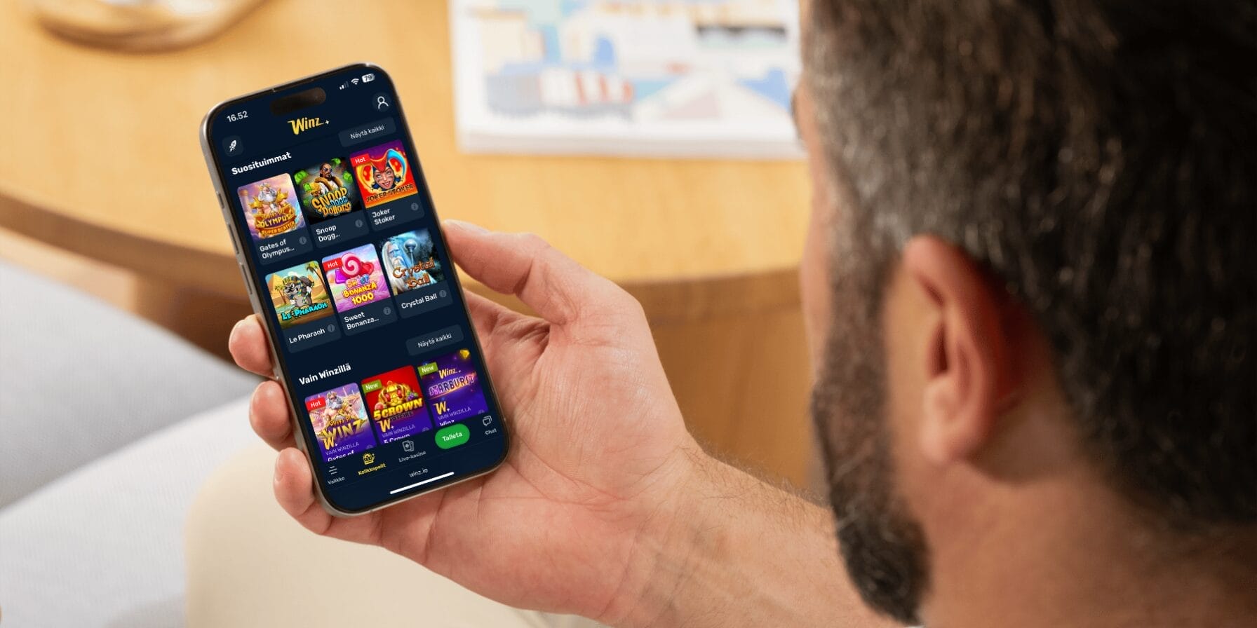 Winz mobiilikasino puhelimen näytöllä